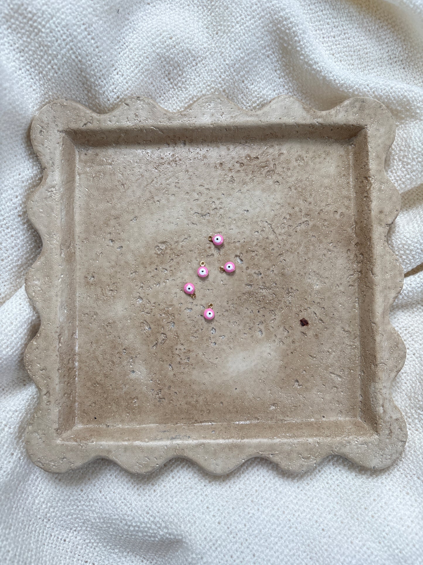 pendentif œil rose clair
